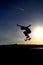 Skateboarder performing an aerial skateboarding jump trick