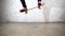 Skateboarder performing skateboard trick - ollie on concrete. Athlete practicing jump, preparing for competition. Extreme sport,