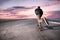 Skateboarder pushing on a concrete pavement