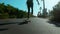 Skateboarder rides longboard on california beach
