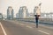 Skateboarder riding a skate over a city road bridge. Free ride s