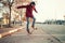 Skateboarding. A man does an Ollie stunt on a skateboard. Jump in the air