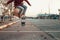 Skateboarding. A man does an Ollie stunt on a skateboard. Jump in the air. Close-up of legs