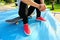 Skateboarding woman sit skatepark