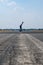 Skater on empty asphalt road / runway on former airport