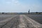 Skater on empty asphalt road / runway on former airport