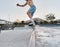 Skater, fitness and feet of man skateboarding in a park for fun, adventure and fitness. Sports, active and training of a