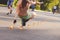 Skater girl performing trick in squatting position