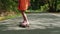 skater girl is riding on skateboard at summer vacation in forest park