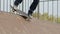 Skater make trick feeble stand on edge of ramp radius, close-up, slowmotion