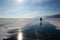 The skater on mirror surface of Baikal ice between cracks and hummocks