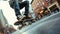 Skater performing a trick on a city street with vivid urban art in the background.