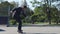 Skater in a suit goes the trick, Heelflip