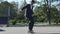 Skater in a suit goes the trick, No comply