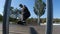 Skater in a suit rides a ramp, close up view