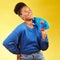 Skater, thinking or happy black woman with skateboard laughing isolated on yellow background in studio. Trendy African