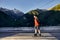 Skater traveling in the mountains on his longboard