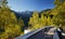 Skater traveling in the mountains on his longboard