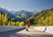 Skater traveling in the mountains on his longboard