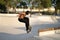 Skaters and bikers practice tricks at an outdoor skatepark during the Corona Virus in Detroit