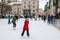 Skating rink,7.01.2017 Ukraine Lviv,children skate in the city on a skating rink in winter