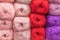 Skeins of knitting thread pink, red