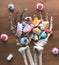 Skeleton hands holding candy on wooden backgrounds