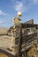 Skeleton standing on  an old truck bed in a dead grass field