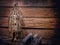 Skeleton in white cage with metal chain and old woods on wooden table and background