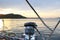 Skeleton winch on board a sailing cruise yacht. The view from the cockpit on the sunset background. Quiet and calm morning