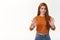 Skeptical and unimpressed pretty caucasian redhead woman rejecting terrible offer, dont like and raise hands in stop