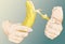Sketchy illustrated hands peeling a banana