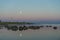 Skew lighthouse in the Baltic Sea. Shore, evening light, sunset, moon and architecture concept.