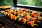 skewered vegetable kabobs roasting on rotisserie grill