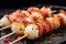 skewers of scallop and bacon speckled with pepper flakes