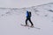 Ski alpinist training in the snowy Austrian Alps with equipment during the daytime