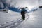 Ski freerider climbing the slope