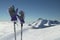 Ski gloves on poles on the background of southern slope Aibga Ridge of Western Caucasus at Rosa Khutor Alpine Resort