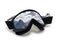 Ski goggles with reflection of snow mountains