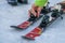 Ski instructor adjusting the boots lock on skis