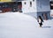 Ski instructor of ski school in a penguin suit. Ski resort in Alps, Austria, Zams