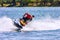 Ski jet watercraft driver in action on summer sunny day