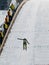 Ski jumper at landing after his jump 