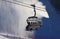 Ski lift against atomized artificial snow