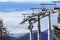 Ski lift cable booth or car, Ropeway and cableway transport sistem for skiers with fog on valley background