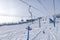 Ski lift, cable car funicular with open cabin on the background