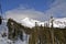 Ski Lift Carries Skiers to Mountain Peak