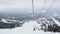 Ski lift chairs on snowy foggy winter day in slowmotion. 1920x1080