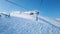 Ski lift runs over white slopes in the alps