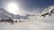 Ski lift, skiers and snowboarders. Winter in French Alps mountains, ski resort landscape, 4K timelapse video